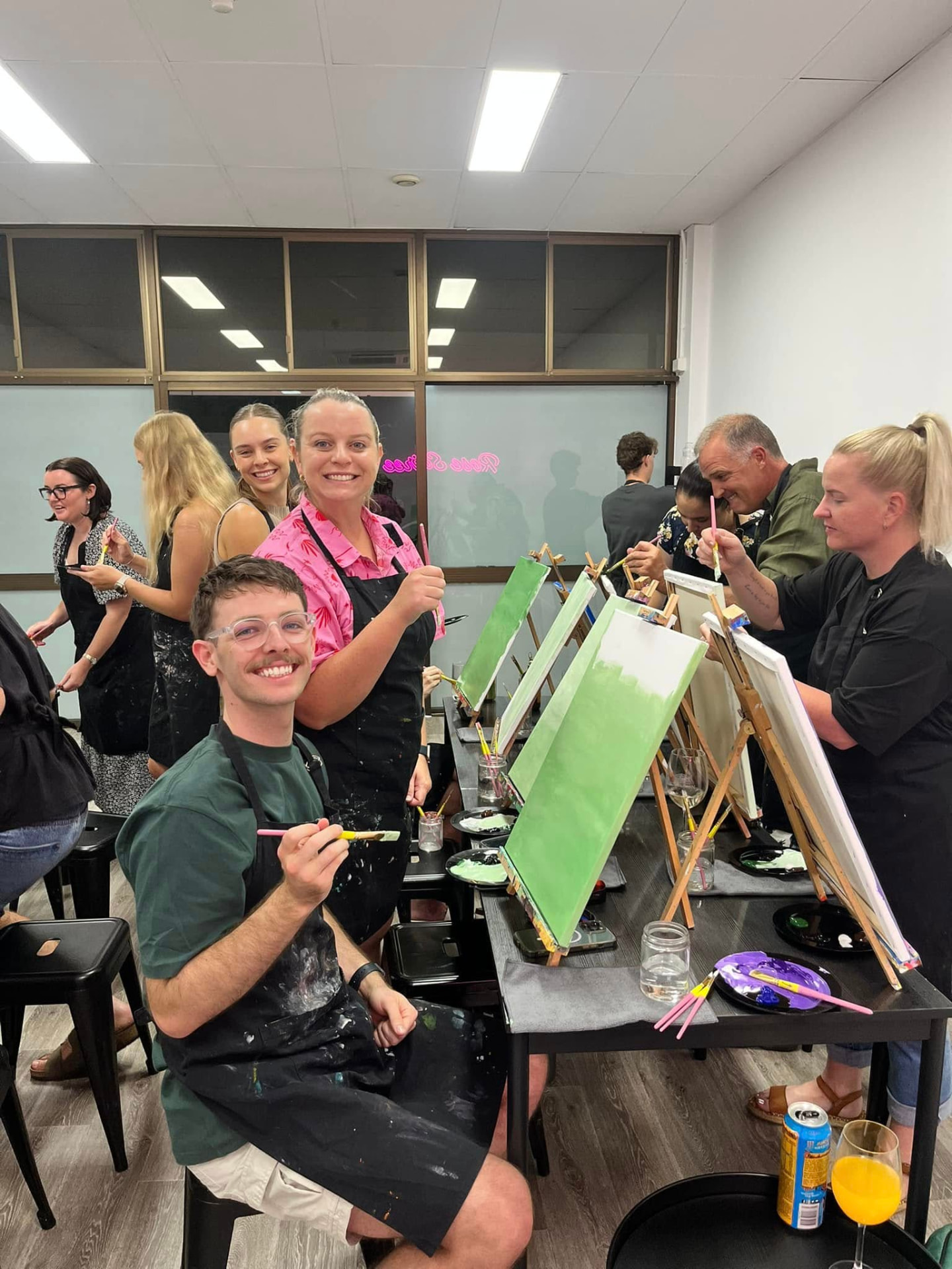 Guests painting together at The Social Canvas